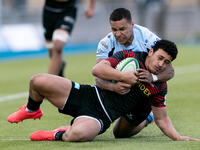 Manu Vunipola of Saracens is tackled by Reuben Bird-Tulloch of Bedford Blues during the Greene King IPA Championship match between Saracens...