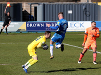 Paul Farman of Carlisle United saves from Barrow's Scott Quigley  during the Sky Bet League 2 match between Barrow and Carlisle United at Ho...