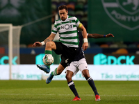Sebastian Coates of Sporting CP (L) vies with Anderson Oliveira of FC Famalicao during the Portuguese League football match between Sporting...