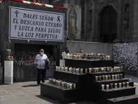 A woman visits a memorial dedicated to the deceased and sick people of COVID-19 in Mexico, located in the Plaza Juan Pablo II inside the Bas...