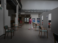 A nurse waiting for people in an empty vaccination point in Pisa, Italy, on April 12, 2021. The campaign for vaccination against Covid-19 ro...