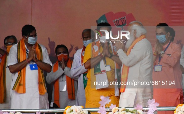 Indian  Prime Minister Narendra Modi  gestures   during   a mega  rally of  Bharatiya Janata Party (BJP) ahead of the state legislative asse...