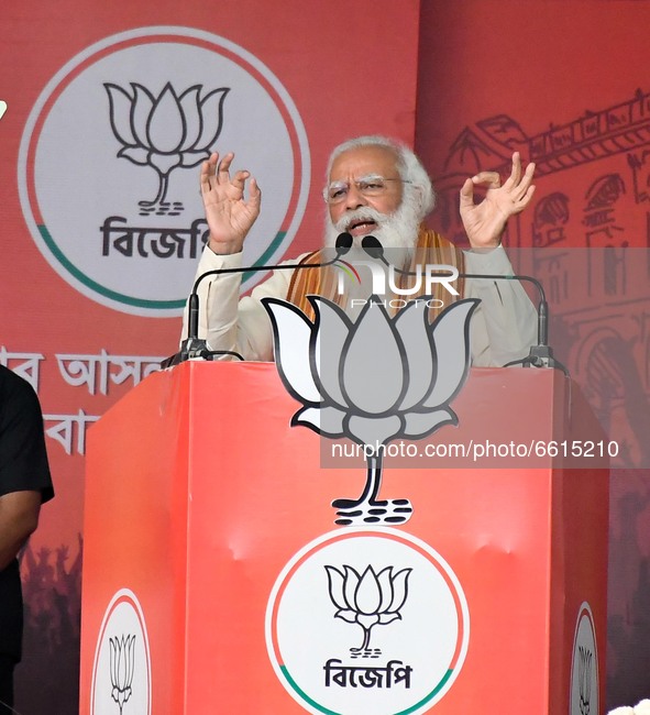 Indian  Prime Minister Narendra Modi deliver his speech to the supporters  of  Bharatiya Janata Party (BJP) during a mega  rally ahead of th...