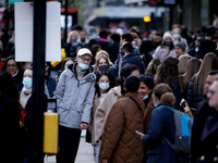 Shoppers, some wearing face masks, pack Oxford Street in London, England, on April 12, 2021. Coronavirus lockdown measures were further ease...