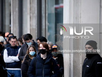 Shoppers wearing face masks queue outside a store at Oxford Circus in London, England, on April 12, 2021. Coronavirus lockdown measures were...