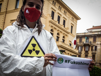Environmental activists demonstrate  protest in front of the Japanese embassy  in Rome, Italy, on April 15, 2021 against the Japanese govern...