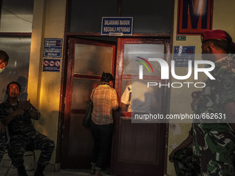 An Indonesian military guard in front of the morgue at the hospital of victim air force-owned aircraft that crashed in Medan, North Sumatra,...
