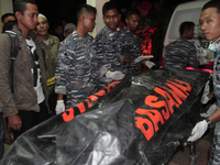 Indonesian military personnel to record victims' bodies fall of Hercules C-130 for the identification, at the Adam Malik Hospital in Medan,...