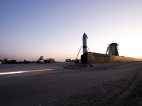 Starship SN15 is prepared for static fire and launch at  SpaceX's South Texas build site as the sun sets on April 20th, 2021 in Boca Chica,...