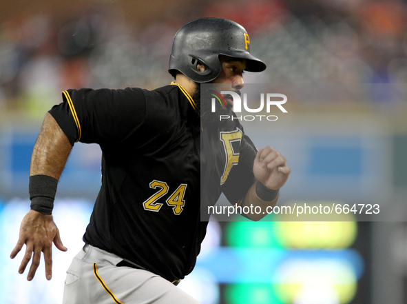 Pittsburgh Pirates' Pedro Alvarez scores a run on a sacrifice fly to fielder by Jordy Mercer in the third inning of a baseball game against...