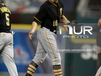 Pittsburgh Pirates' Neil Walker heads to the dugout after finishing the 15th inning of a baseball game against the Detroit Tigers in Detroit...