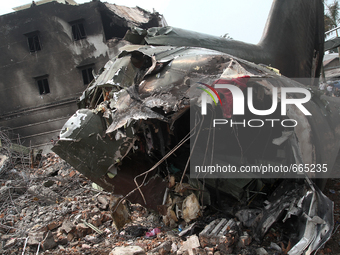 Ruins bodies Indonesian aircraft C-130 Hercules which was perched a day after the crash in Medan, North Sumatra, Indonesia on July 1, 2015....