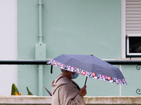 A women using umbrella to protect yourself from bad weather in Lisbon, Portugal, on April 26, 2021.
Lola Storm hits Portugal with winds and...