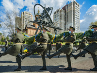 Soldiers march with a flower tribute during the celebrations in Kiev, Ukraine, on April 26, 2021 of the 35th anniversary of the Chernobyl  n...