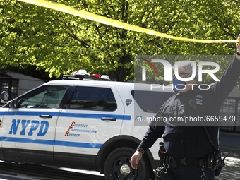 Police officers stand at a street closure point after the New York Police Department Bomb Squad and ATF agents were called about a suspiciou...