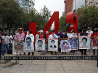 Relatives of the 43 students of the Normal Raul Isidro Burgos School  of Ayotzinapa, on April 26, 2021 in Mexico City, Mexico join a protest...