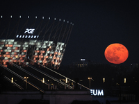 The Pink Super Moon is seen rising near the National Stadium in  Warsaw, Poland on April 27, 2021. The Pink Super Moon is second to last sup...