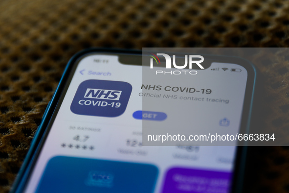 NHS COVID-19 on the App Store is seen displayed on a phone screen in this illustration photo taken in Krakow, Poland on April 28, 2021.  (Ph...