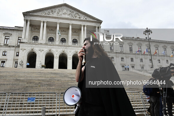 A student using a megaphone encourages the demonstrators in front of the Republic Assembly palace. April 28, 2021. Demonstrators from differ...