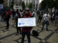 Students wearing protective masks march through the streets of Lisbon to demand their rights as students. April 28, 2021. Demonstrators from...