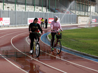  Palestinian women ride bicycles at the Yarmouk Stadium in Gaza city on April 28, 2021. The 
