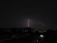 View of thunderstorm in the Lomas Estrella neighborhood, Iztapalapa, Mexico City, Mexico, on April 28, 2021 during the COVID-19 health emerg...