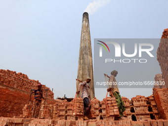 Labourers working at a brickfield on the outskirts of Dhaka, Bangladesh, on March 30, 2021 (