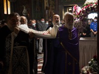The time of the dethronement of Christ from the cross in  the church of Saint Panteleimon of Acharnai in Athens, Greece, on April 30, 2021....