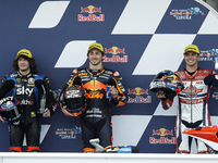 (L-R) Marco Bezzecchi (#72) of Italy and Sky Racing Team VR46 Kalex, Remy Gardner (#87) of Australia and Red Bull KTM Ajo Kalex and Fabio Di...