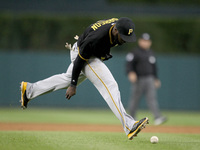 Pittsburgh Pirates' Starling Marte cannot catch the ball hit by Detroit Tigers'  J.D. Martinez in the sixth inning of a baseball game in Det...