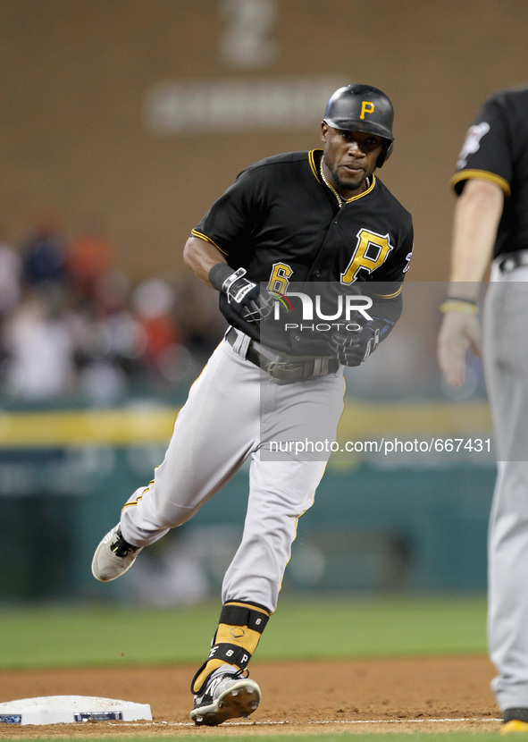 Pittsburgh Pirates' Pedro Alvarez rounds the bases after his solo home run in the eighth inning of a baseball game against the Detroit Tiger...