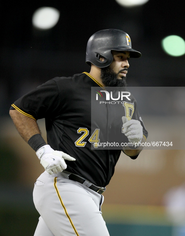 Pittsburgh Pirates' Pedro Alvarez rounds the bases after his solo home run in the eighth inning of a baseball game against the Detroit Tiger...
