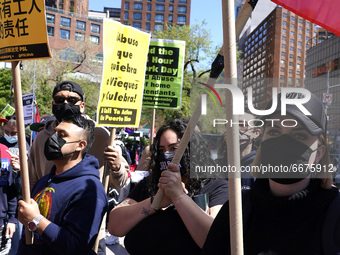 People voice their concerns during May Day Rally in support of various causes affecting immigrants, laborers and union workers on May 1, 202...