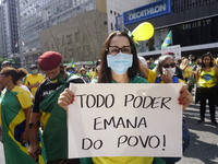 People take part in a demonstration to show their support for Brazilian President Jair Bolsonaro amid the COVID-19 novel coronavirus disease...
