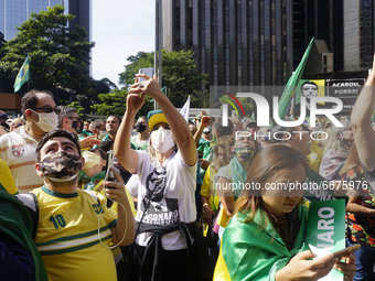 People take part in a demonstration to show their support for Brazilian President Jair Bolsonaro amid the COVID-19 novel coronavirus disease...