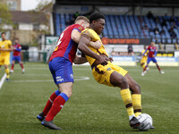 Isaac Olaofe of Sutton United being held by George Fowler of Aldershot Town during National League between Sutton United and Aldershot Town...