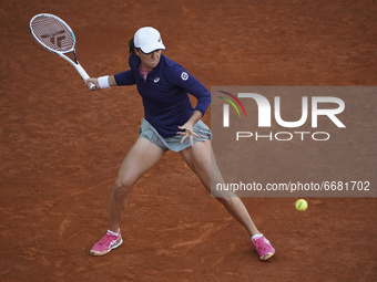 Iga Swiatek of Poland in action during her match against Ashleigh Barty of Australia at La Caja Magica on May 03, 2021 in Madrid, Spain. (
