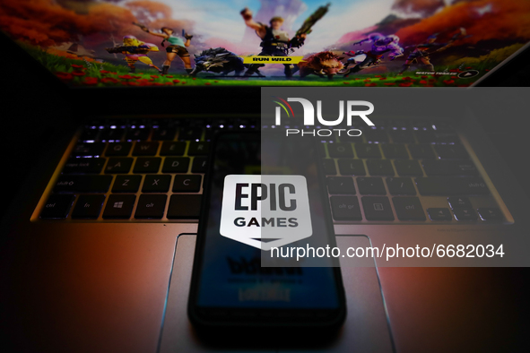 Epic Games logo is seen displayed on a phone screen in this illustration photo taken in Krakow, Poland on May 3, 2021. (Photo illustration b...