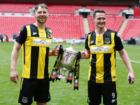 L-R Louis Storey of Hebburn Town and Graeme Armstrong of Hebburn Town with Trophy  during The 2019/2020  Buildbase FA Vase Final between Con...
