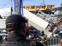  A military is seen during the rescue the bodies of the victims where Mexico City subway olivos station overpass collapsed, killing 23 and i...