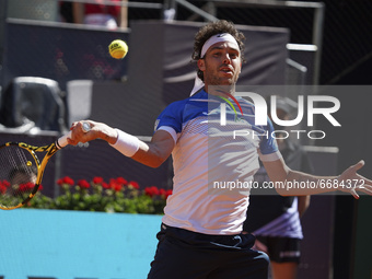 Marco Cecchinato in action during in his mens singles match against Roberto Bautista Agut of Spain during day six of the Mutua Madrid Open a...