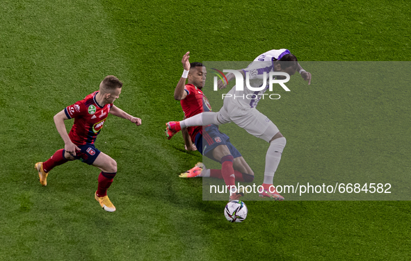 Alef of MOL Fehérvár competes for the ball with Junior Tallo of Újpest FC during the MOL Hungarian CUP Final 2021 match between Fehervár and...