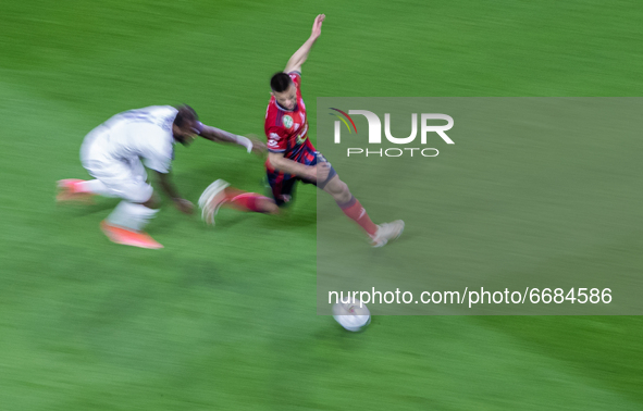Budu Zivzivadze of MOL Fehérvár competes for the ball with Junior Tallo of Újpest FC during the MOL Hungarian CUP Final 2021 match between F...