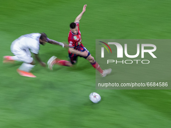 Budu Zivzivadze of MOL Fehérvár competes for the ball with Junior Tallo of Újpest FC during the MOL Hungarian CUP Final 2021 match between F...