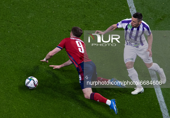 Budu Zivzivadze of MOL Fehérvár competes for the ball with Branko Pauljevics of Újpest FC during the MOL Hungarian CUP Final 2021 match betw...