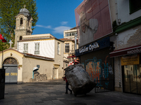A waste collector seen in an empty street in Istanbul, Turkey seen on May 5, 2021. The government imposed a 19-day curfew which started on A...