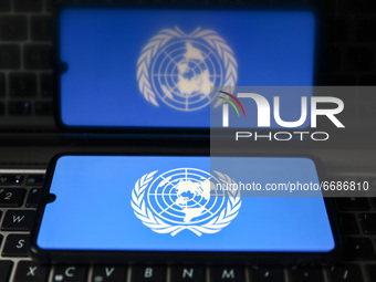 United Nations logo is displayed on a mobile phone screen photographed for illustration photo. Gliwice, Poland on May 5, 2021. (