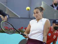 Aryna Sabalenka of Belarus in action during her quarterfinal match against Elise Mertens of Belgium during day seven of the Mutua Madrid Ope...