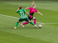 Luca Papp of FTC-Telekom competes for the ball with Gabriella Rozmis of Astra-TP-Üllő during the match at Hungarian Women CUP Final 2021 at...