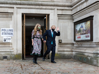 LONDON, UNITED KINGDOM - MAY 06, 2021: British Prime Minister Boris Johnson and his fiancee Carrie Symonds leave a polling station at Method...